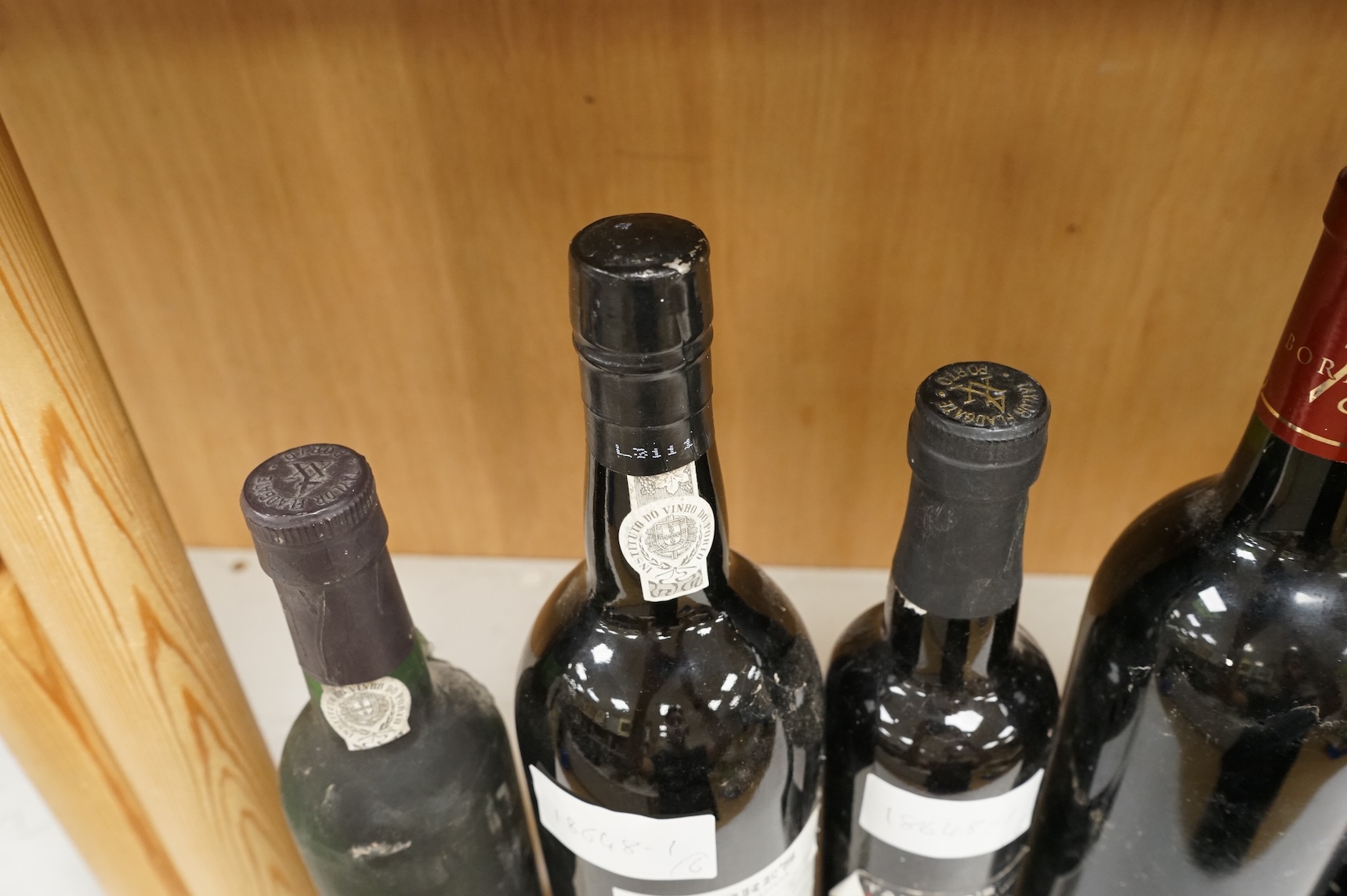 Two bottles of Warres 1988 vintage Port, a half bottle of Taylor's 1997, a Taylor's 10 year old Port, and two bottles of Chateau Lartigue, 2004